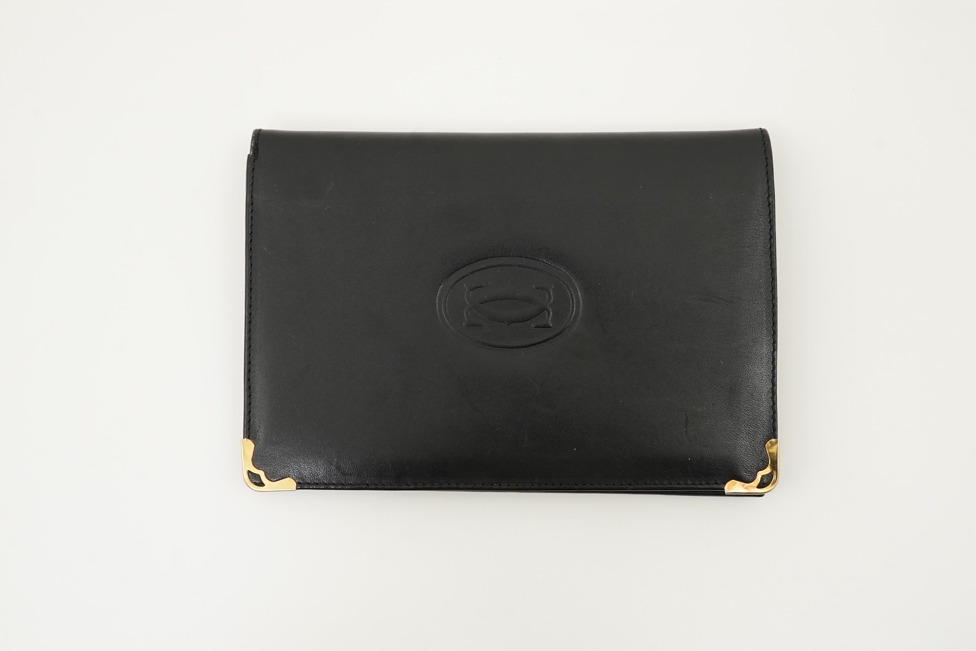 A gentleman's black Cartier wallet